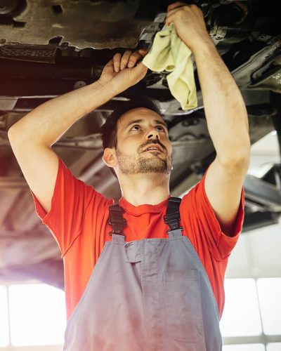 car-mechanics-working-and-maintaining-car-ZWSVXFB.jpg