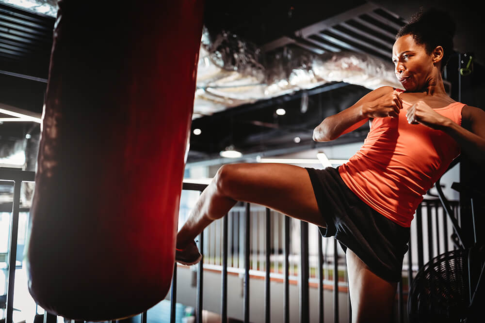 young-fit-woman-boxing-workout-in-gym-REE4XME.jpg